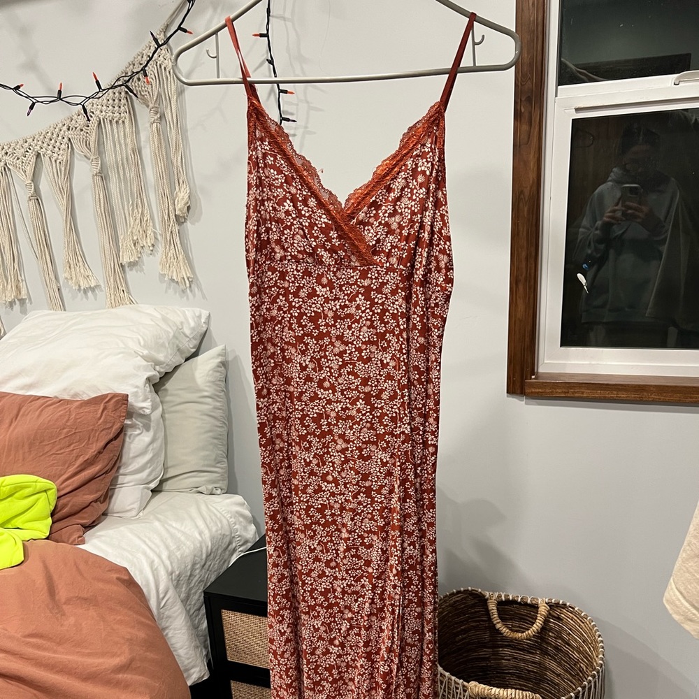 Midi length maroon florals dress.